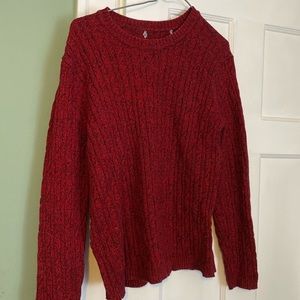 Red cable knit sweater with black stitching